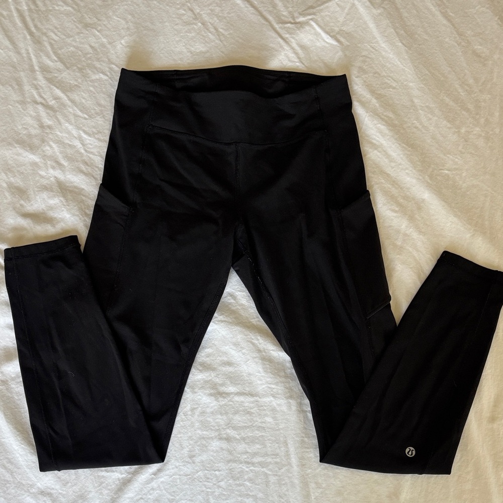 Lululemon black leggings with pockets, excellent used condition, size 8.